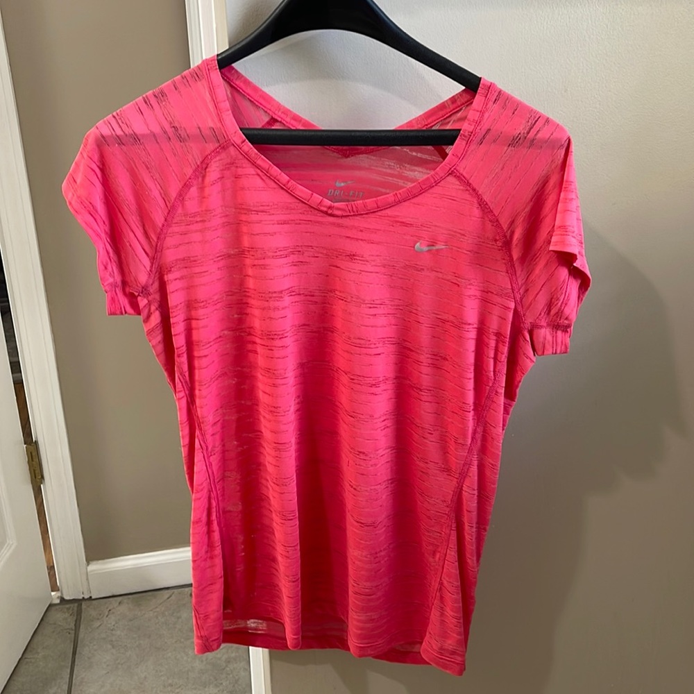 Nike size M. Light weight super comfortable. Red/pink color